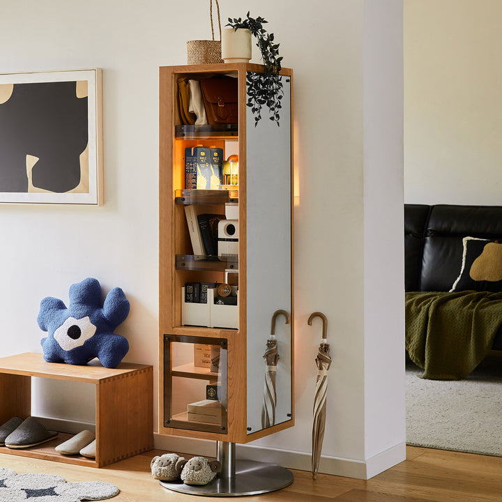 Scandinavian cherry wood revolving bookshelf with mirror twirl in details.