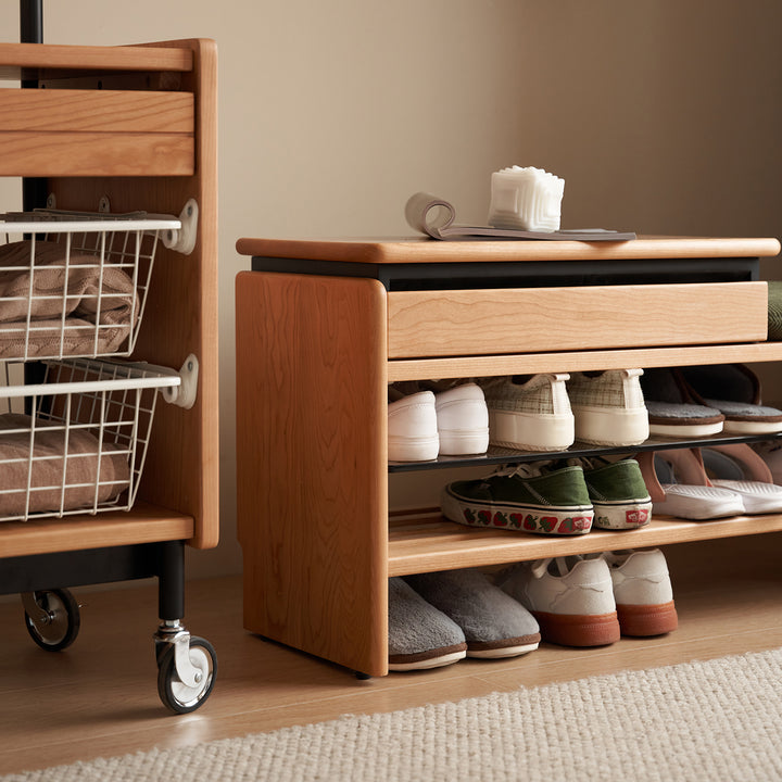Scandinavian cherry wood shoe changing bench mori with context.