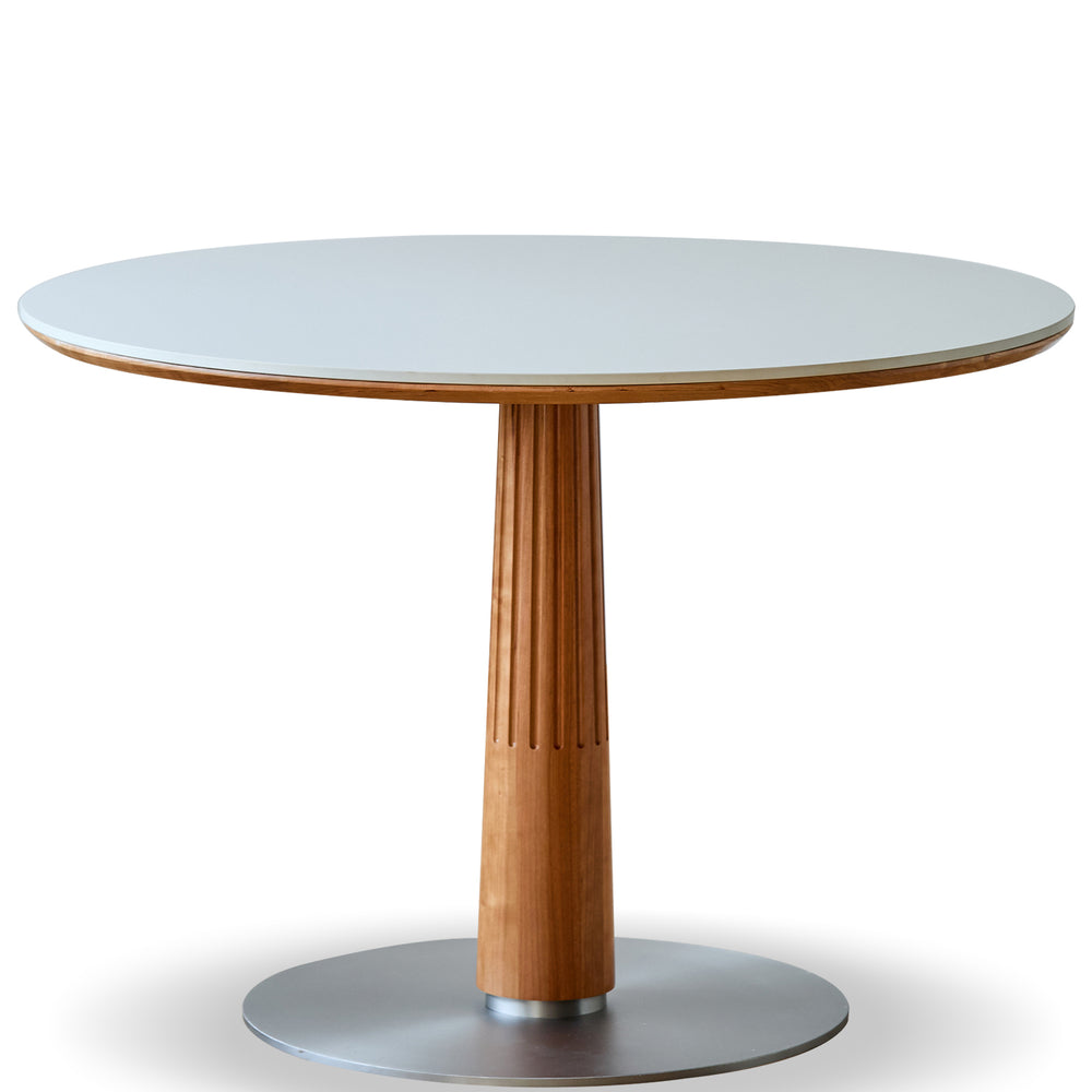 Round table with wooden pedestal and white top on a white background