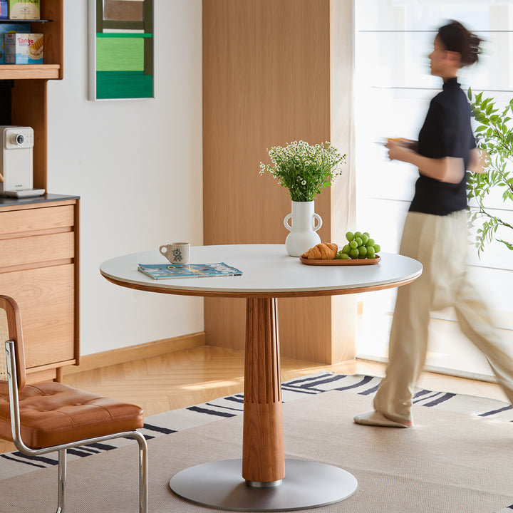 Scandinavian cherry wood sintered stone round dining table grey in close up details.