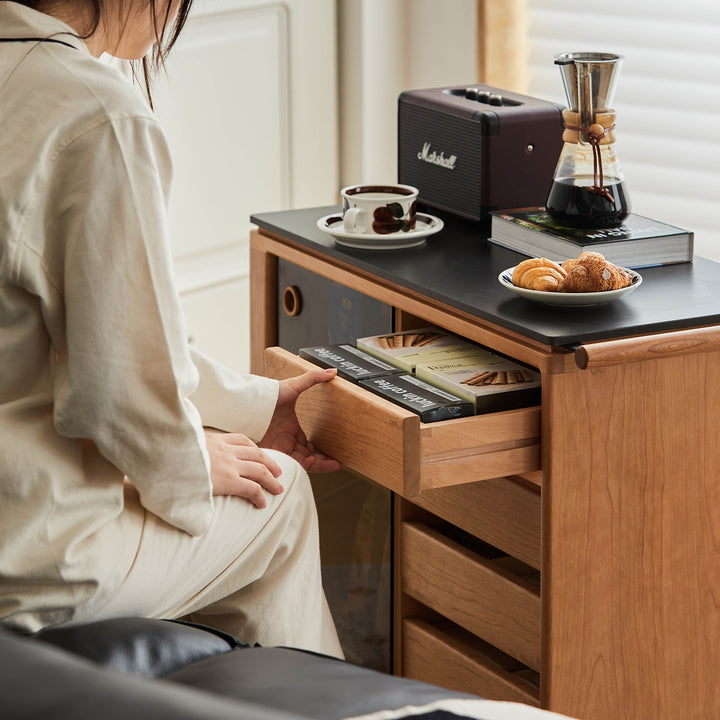 Scandinavian cherry wood wheeled trolley side table bus with context.