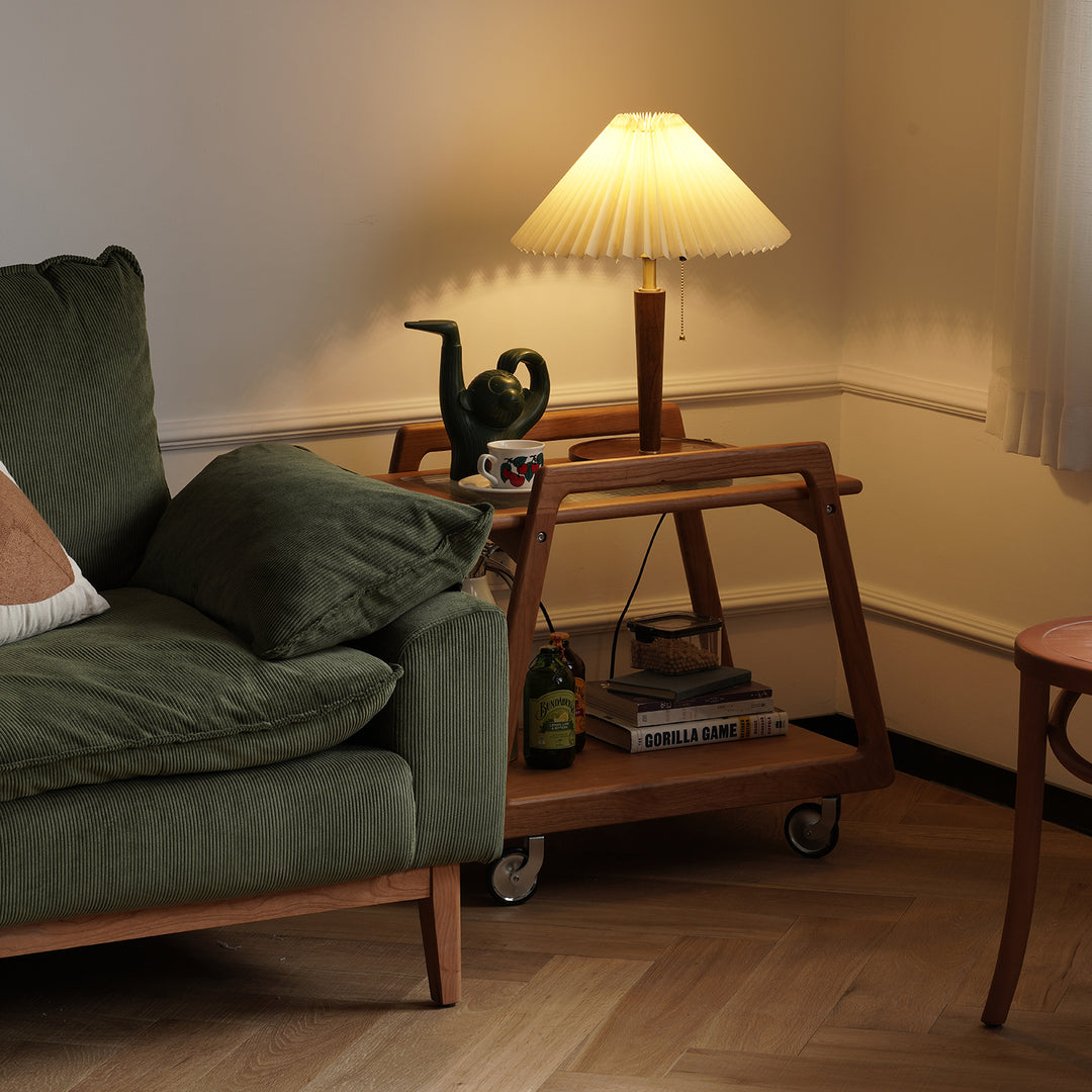 Scandinavian cherry wood wheeled trolley side table yoyo in close up details.