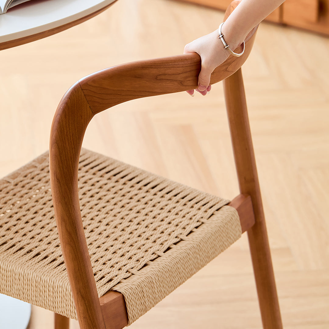 Scandinavian cherry wood woven rope dining chair sona in close up details.