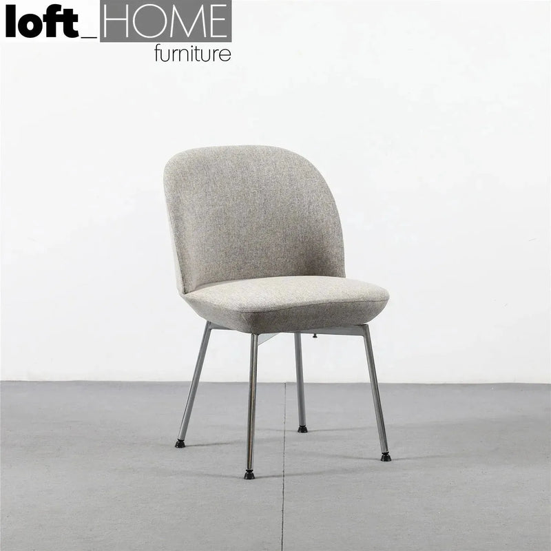 Modern fabric dining chair precious in close up details.