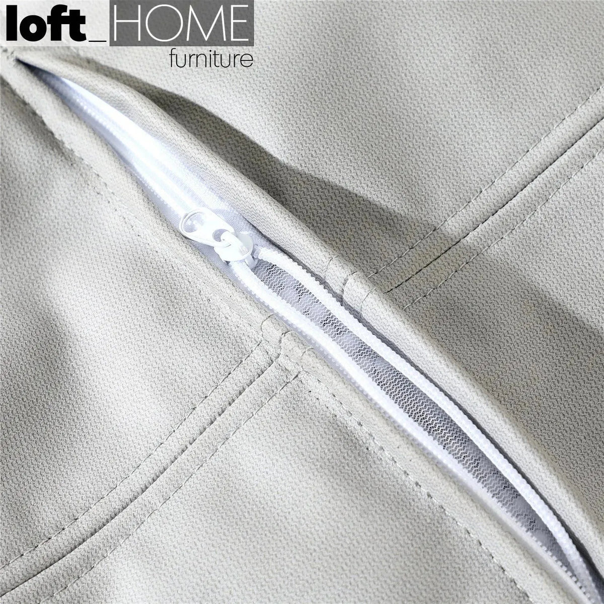 Modern fabric ottoman surya in real life style.