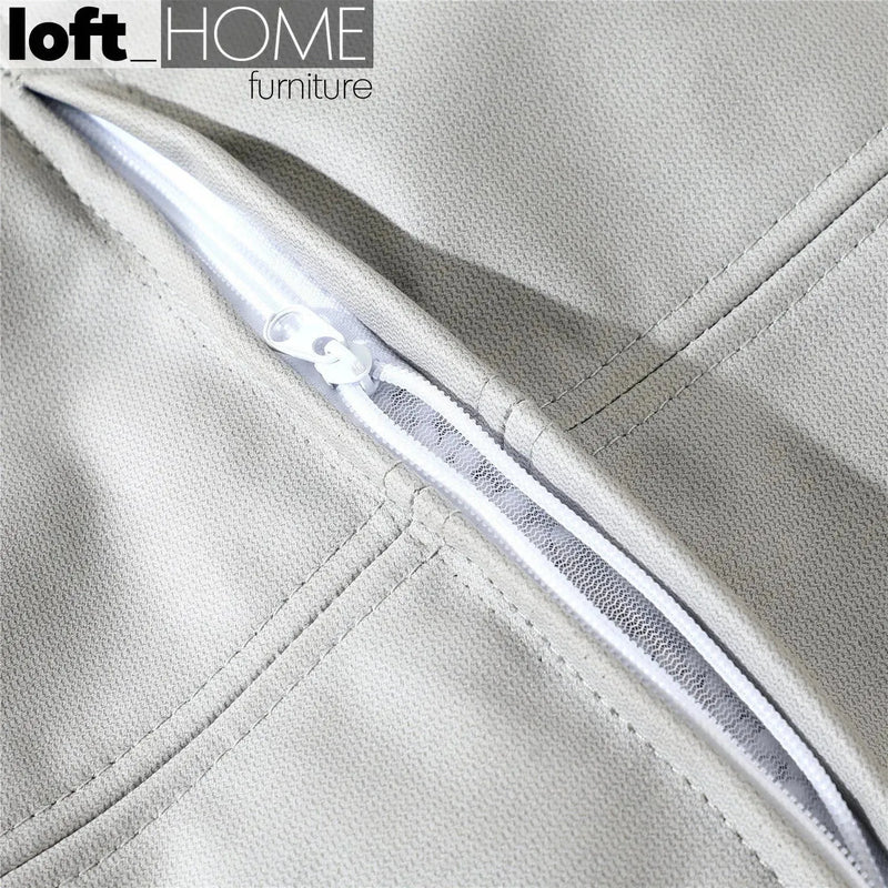Modern fabric ottoman surya in real life style.