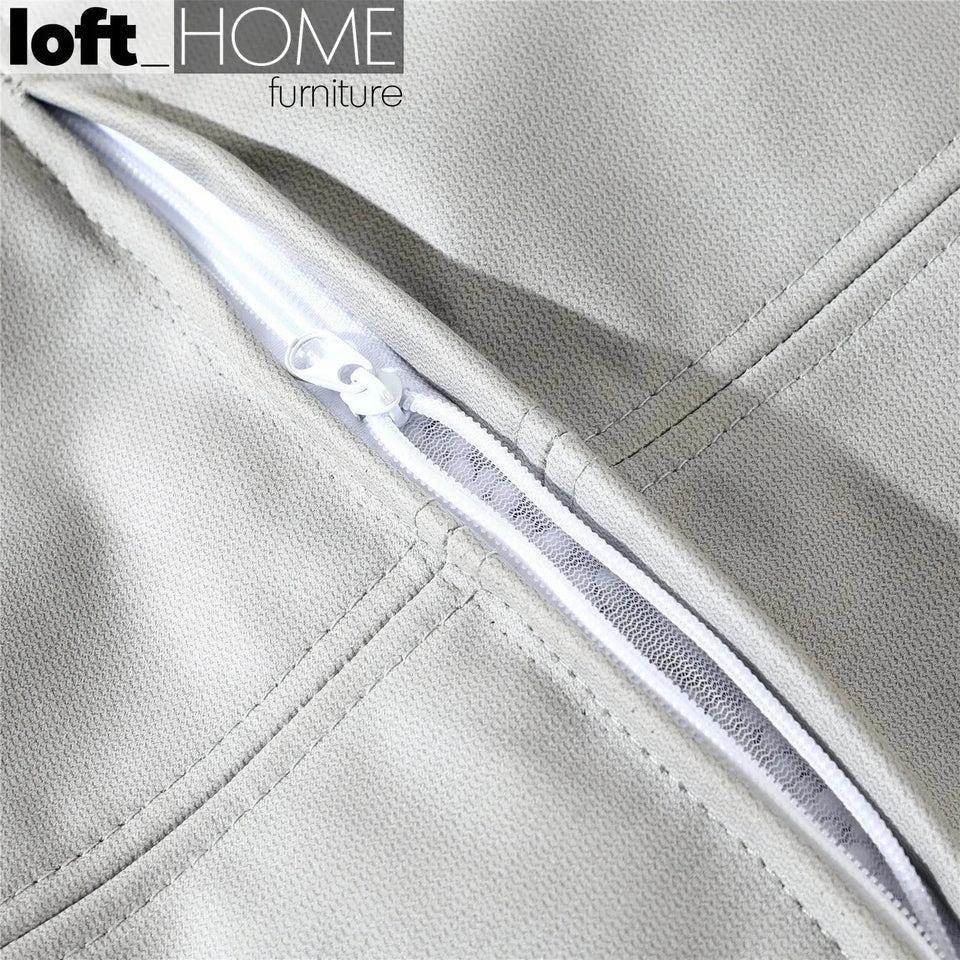 Modern fabric ottoman surya in real life style.
