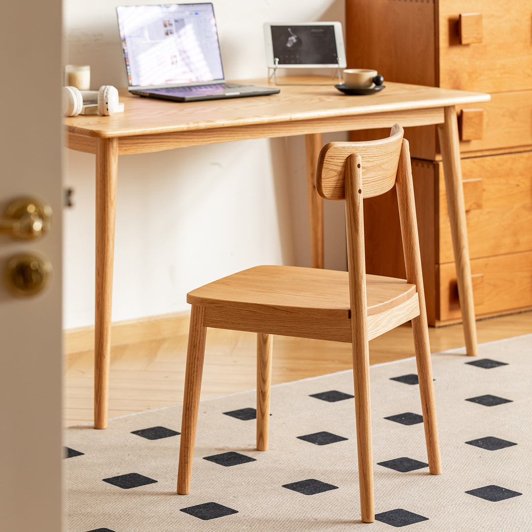 Scandinavian oak wood  dining chair green in panoramic view.