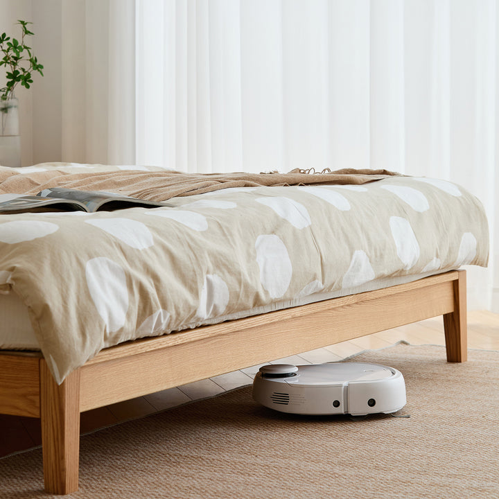 Scandinavian oak wood bed solid with context.