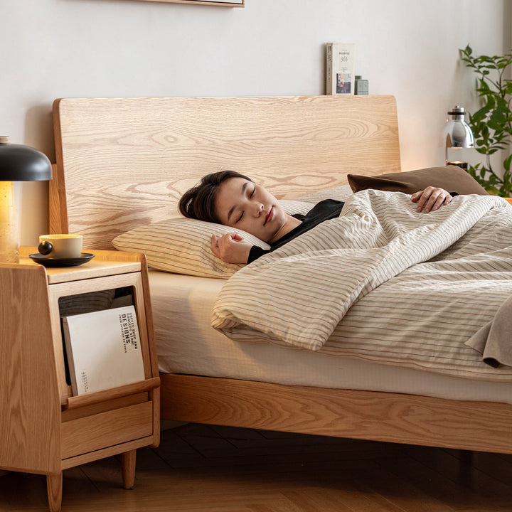 Scandinavian oak wood bed solid in close up details.