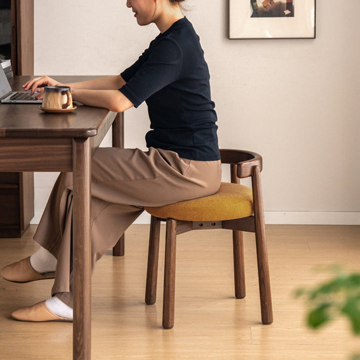 Scandinavian oak wood boucle fabric dressing chair turni in close up details.