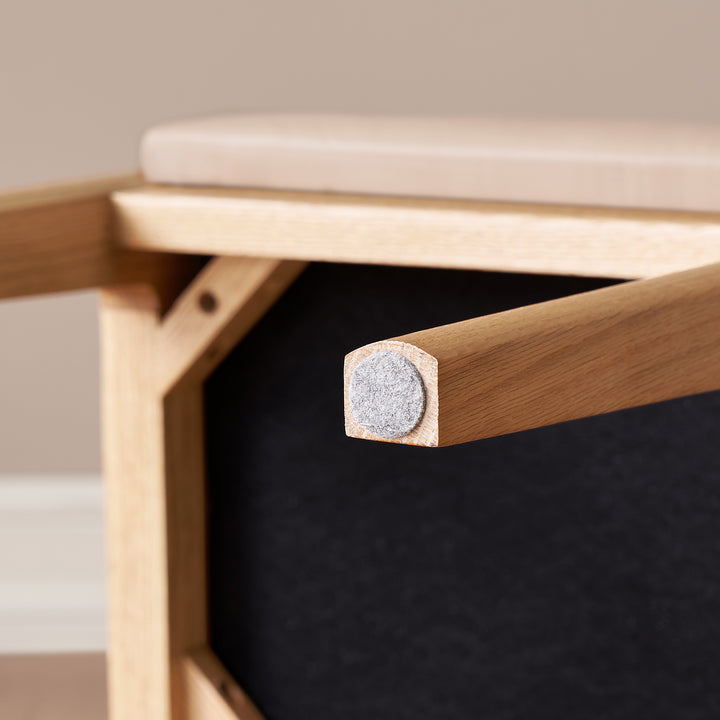 Scandinavian oak wood cat scratch resistant leather dressing chair hemu in still life.