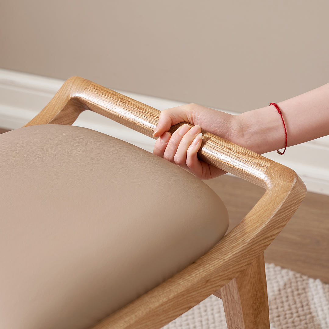 Scandinavian oak wood cat scratch resistant leather dressing chair hemu in close up details.