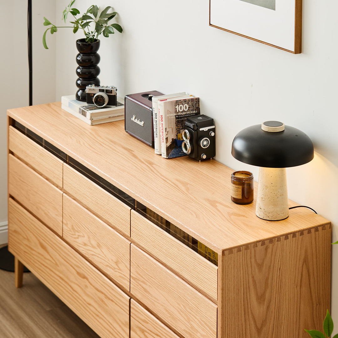 Scandinavian oak wood chest of 8 drawers floating light in real life style.
