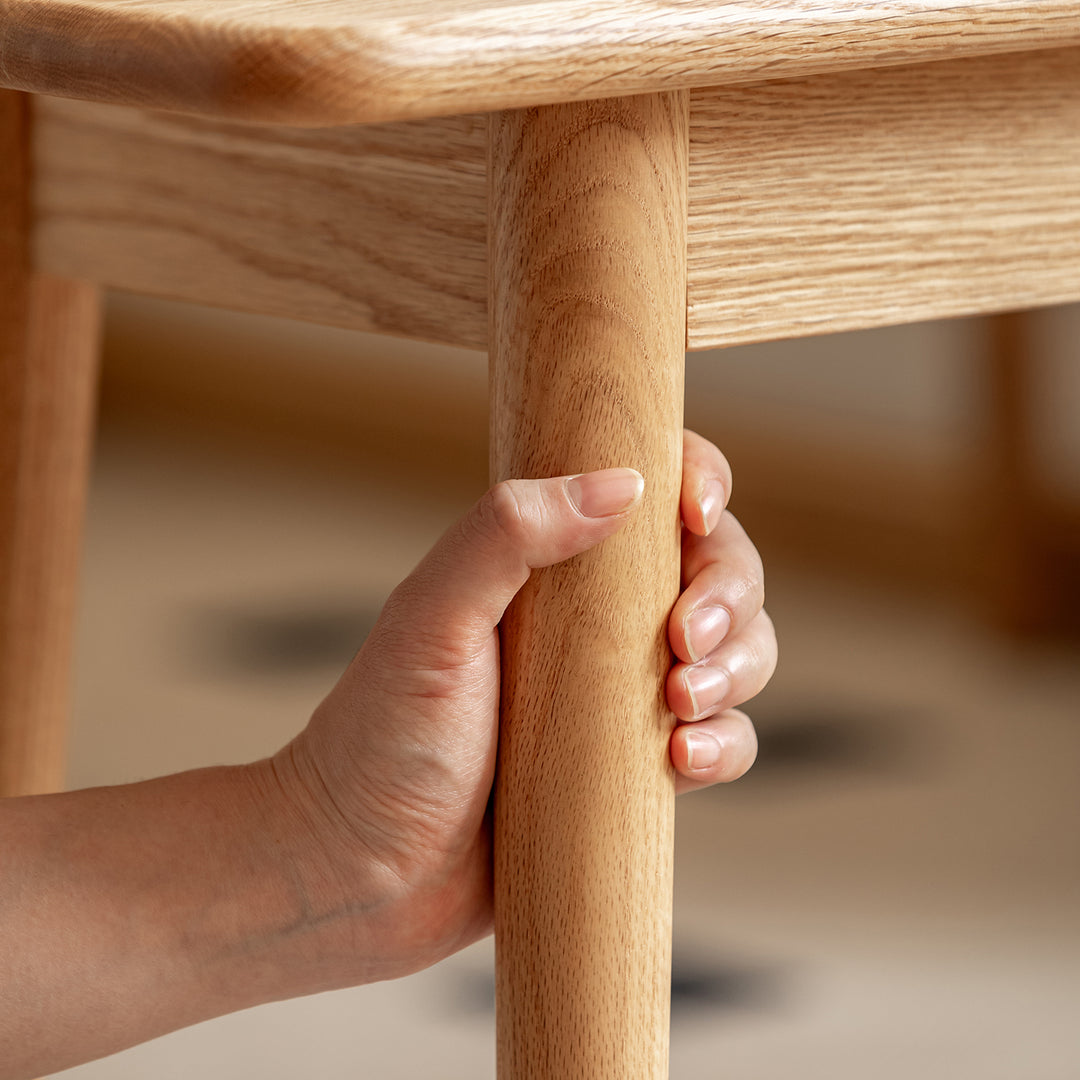 Scandinavian oak wood dining bench green with context.