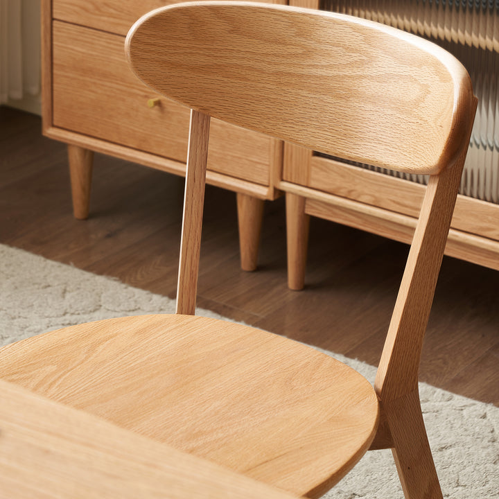 Scandinavian oak wood dining chairs elm in panoramic view.