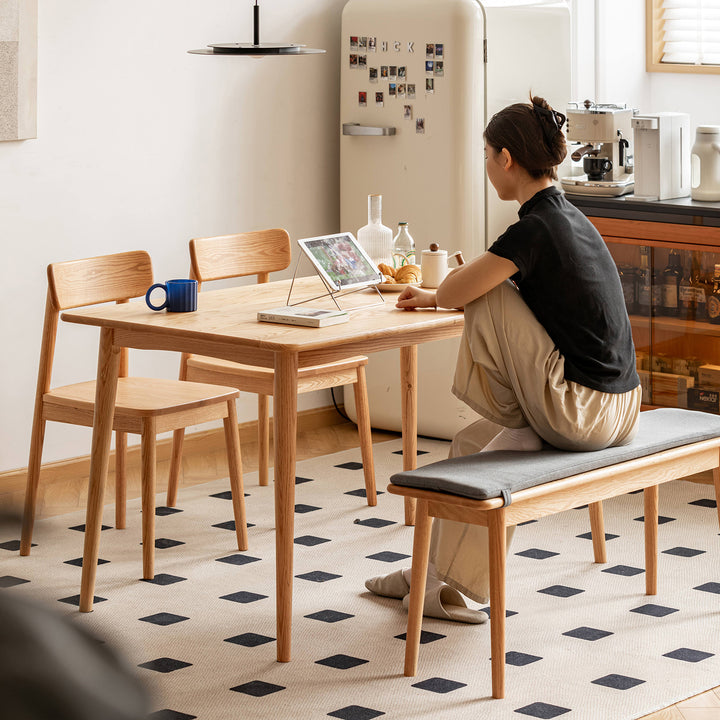 Scandinavian oak wood dining table green in real life style.
