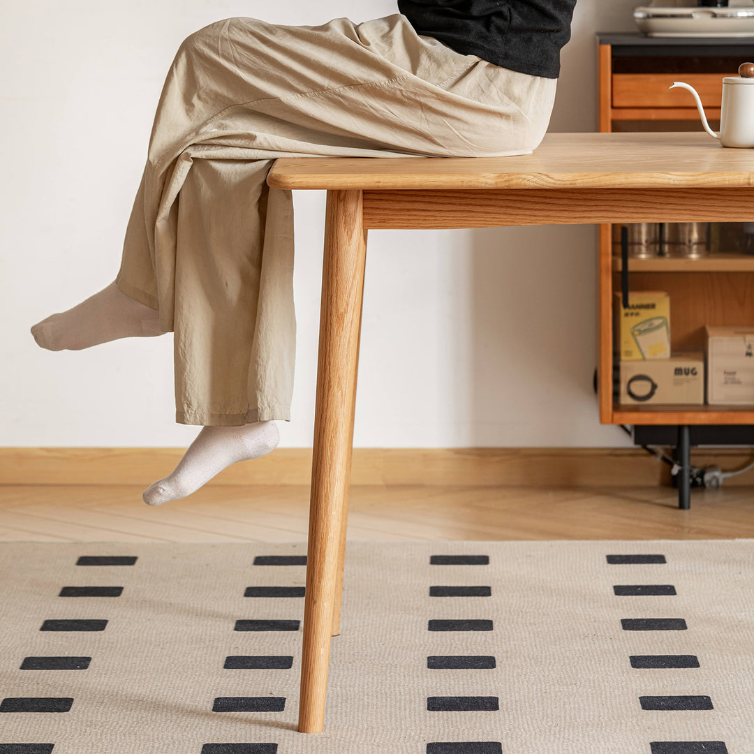 Scandinavian oak wood dining table green with context.