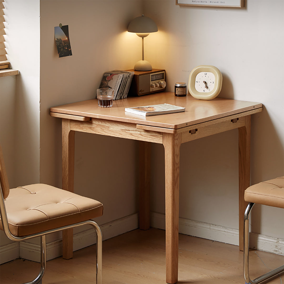 Scandinavian oak wood extendable dining table extendra in still life.