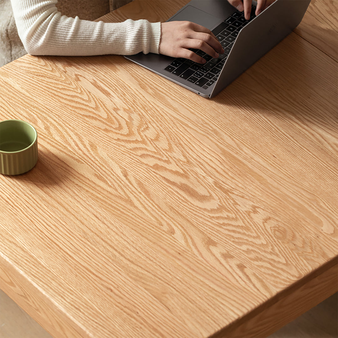 Scandinavian oak wood extendable dining table with shelf nest in still life.
