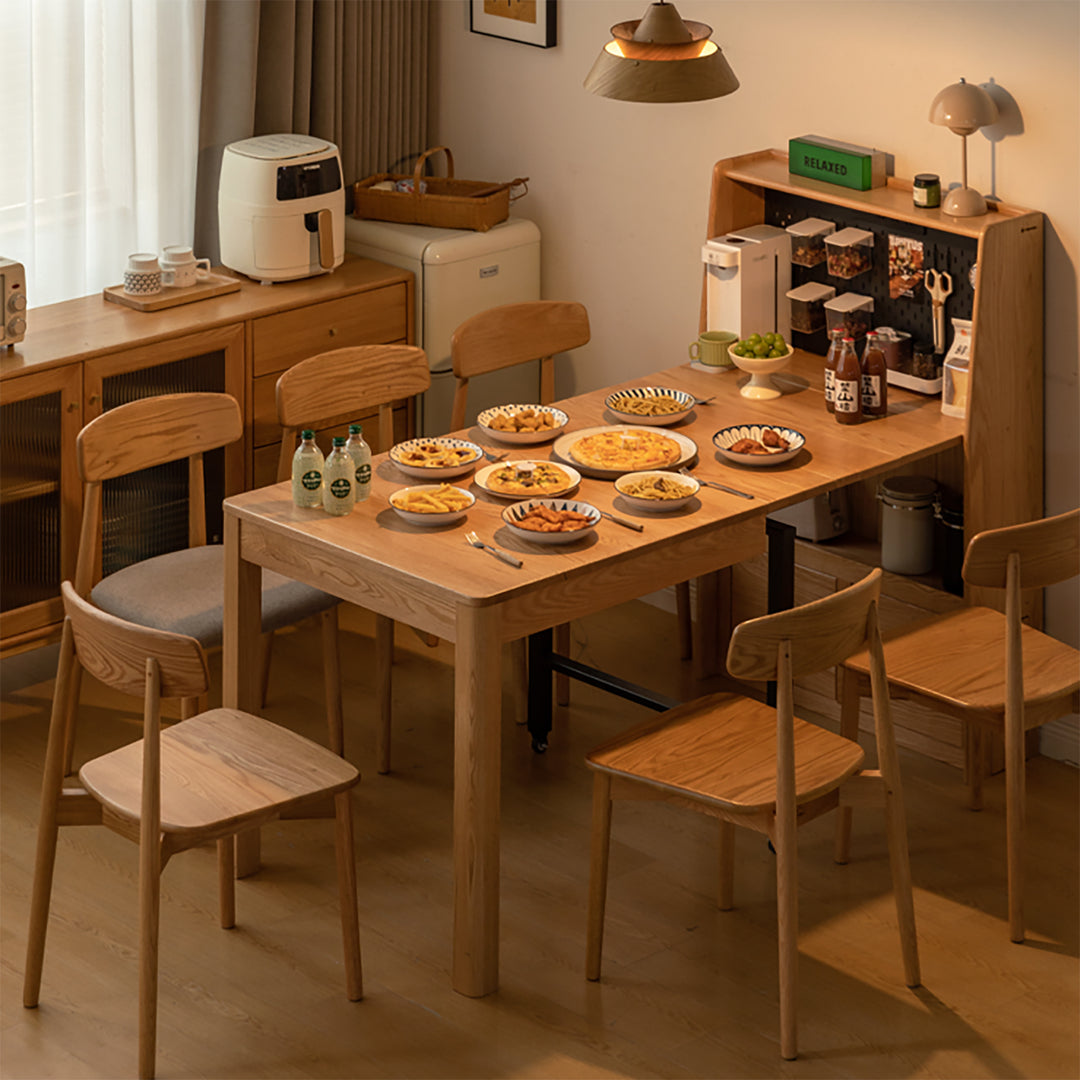 Scandinavian oak wood extendable dining table with shelf nest with context.