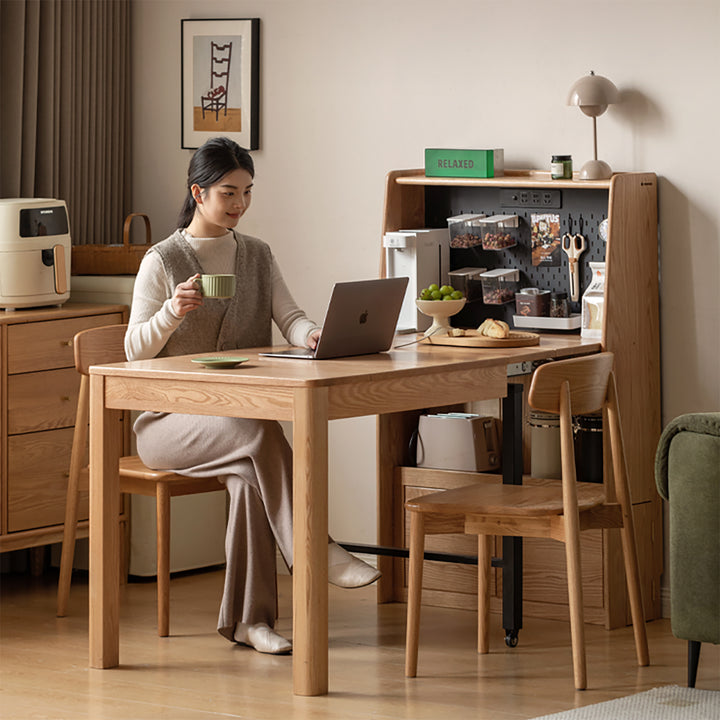 Scandinavian oak wood extendable dining table with shelf nest in panoramic view.