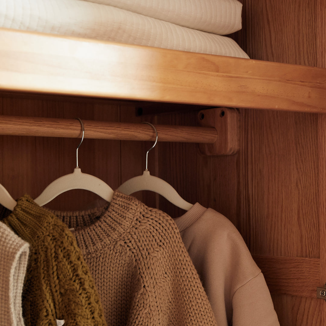 Scandinavian oak wood kids wardrobe cookie in still life.