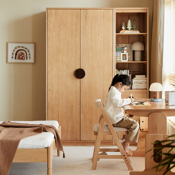Scandinavian oak wood kids wardrobe cookie in close up details.