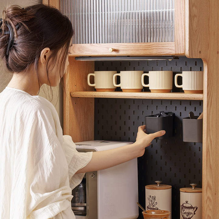 Scandinavian oak wood kitchen cabinet hemu in still life.