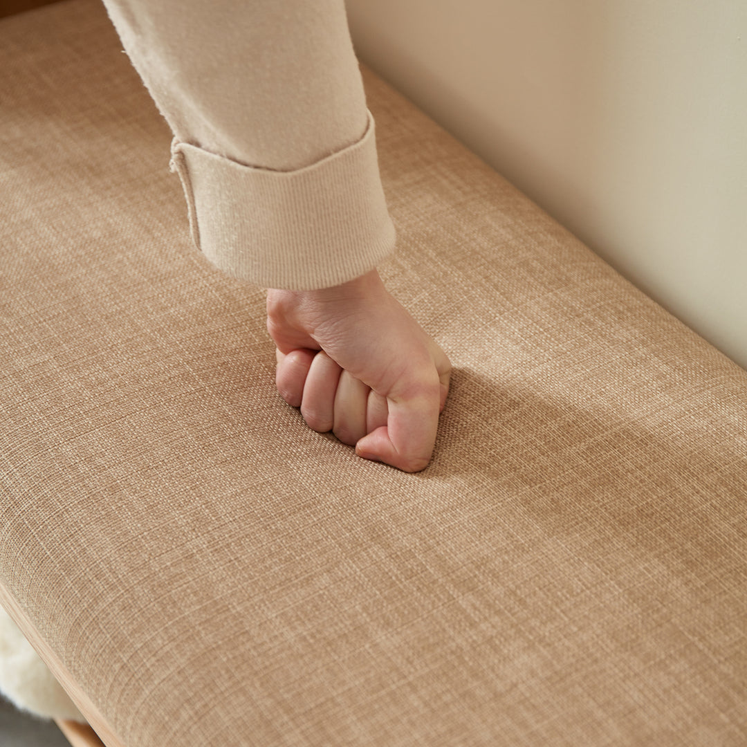 Scandinavian oak wood shoe changing bench fuji in close up details.