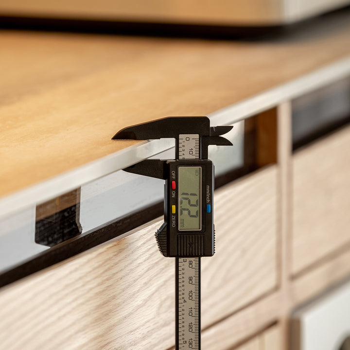 Scandinavian oak wood sintered stone cabinet timeless in panoramic view.