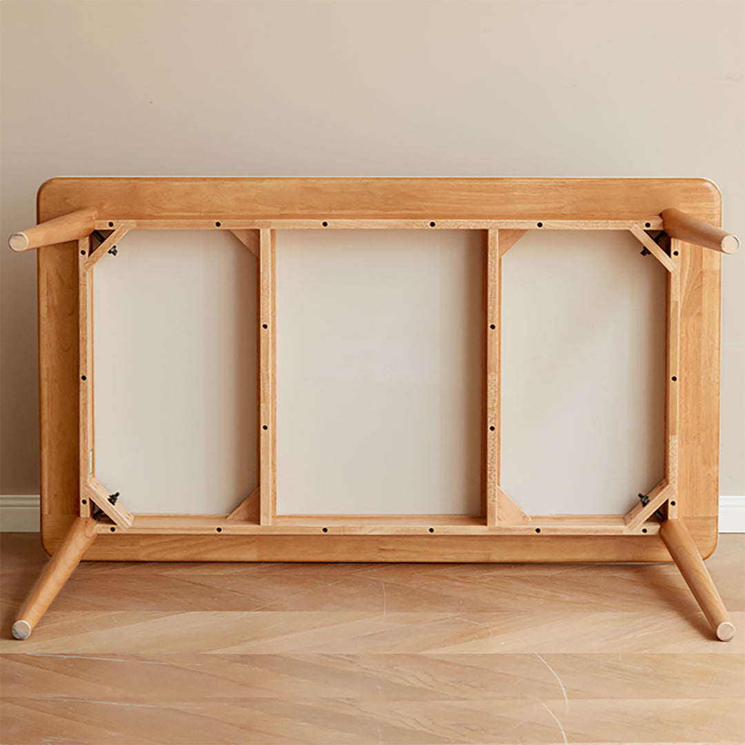 Scandinavian oak wood sintered stone dining table forme in still life.