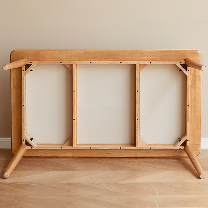 Scandinavian oak wood sintered stone dining table forme in still life.