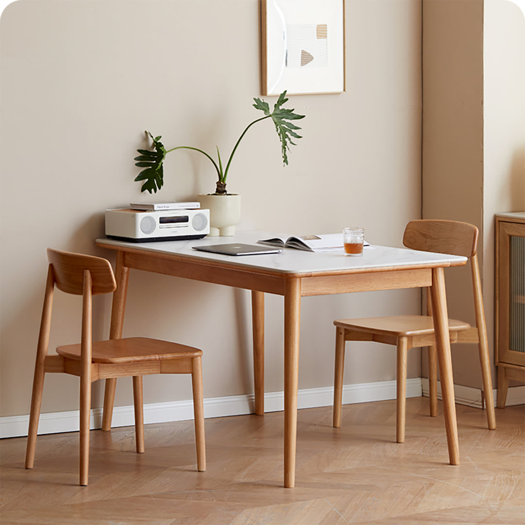 Scandinavian oak wood sintered stone dining table forme in close up details.