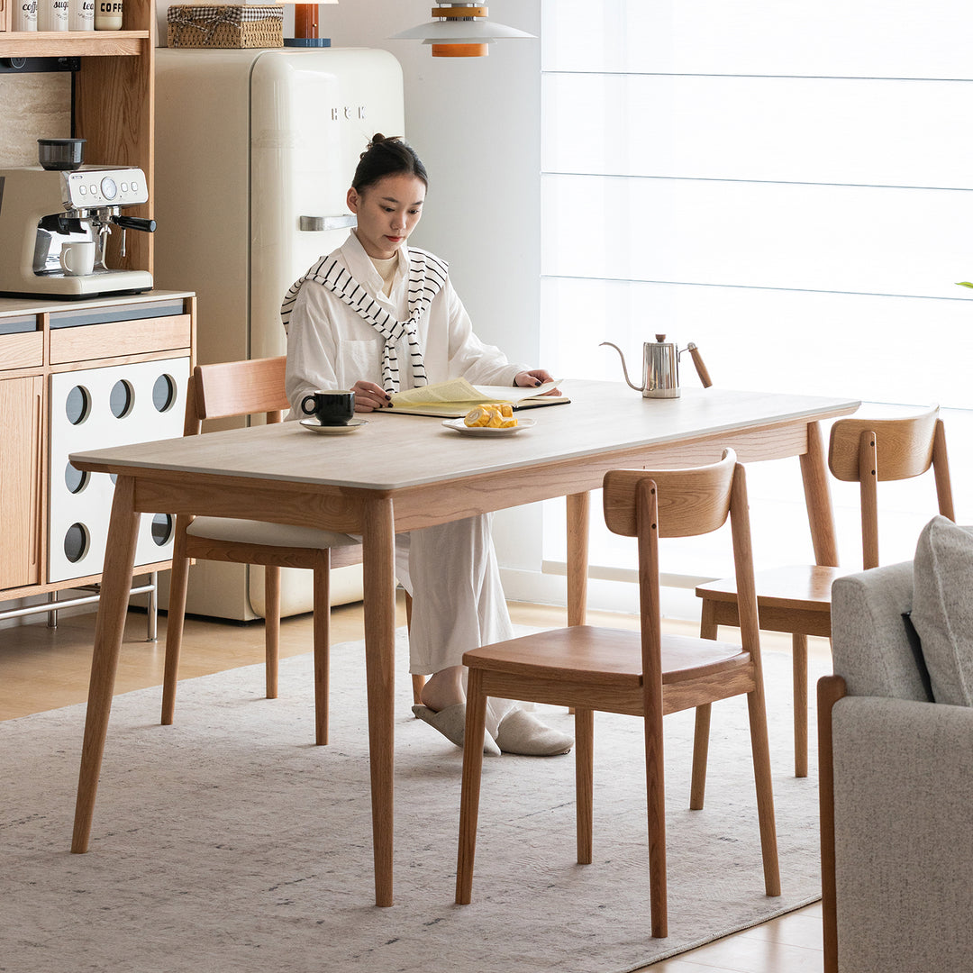 Scandinavian oak wood sintered stone dining table green in panoramic view.