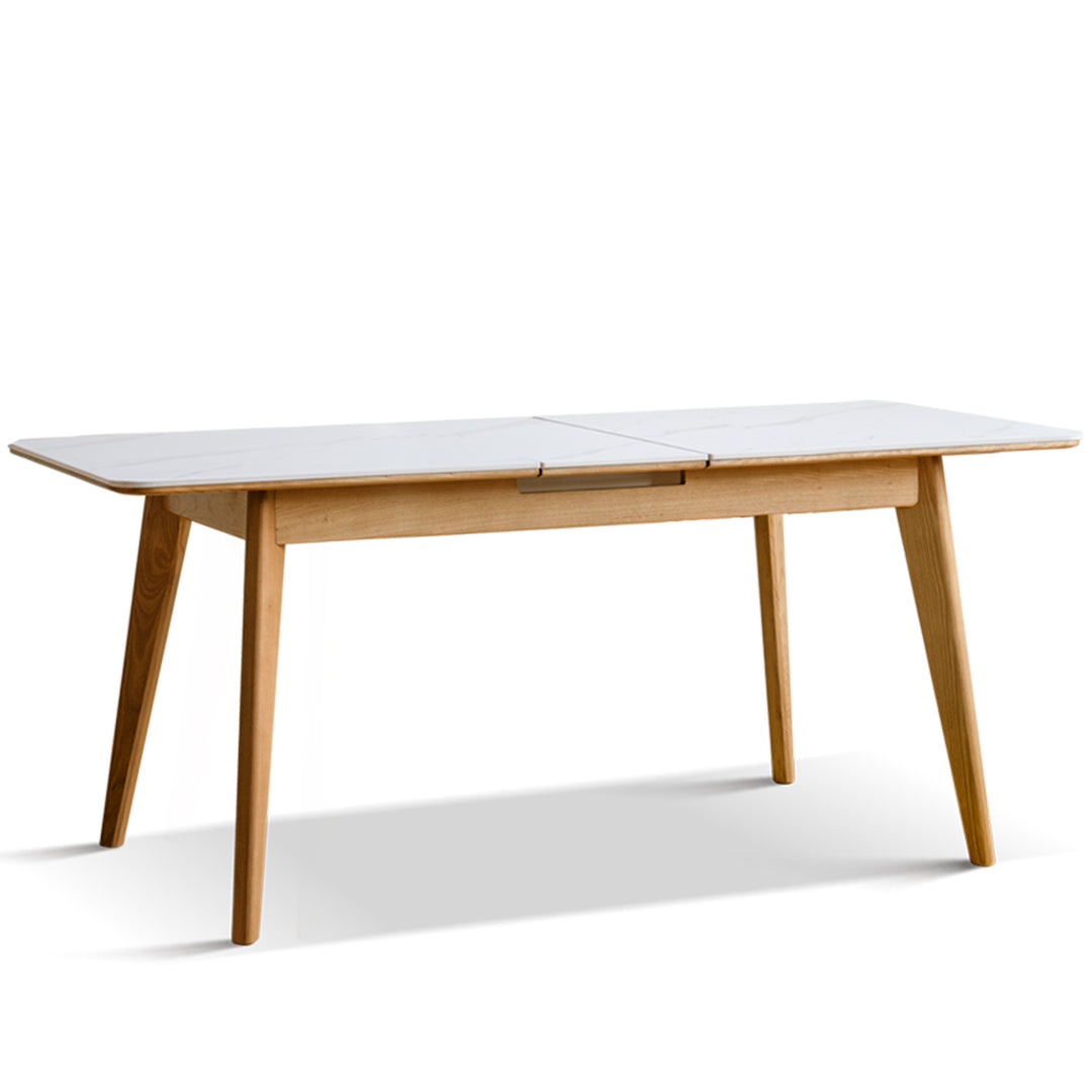 Scandinavian oak wood sintered stone extendable dining table shift in still life.