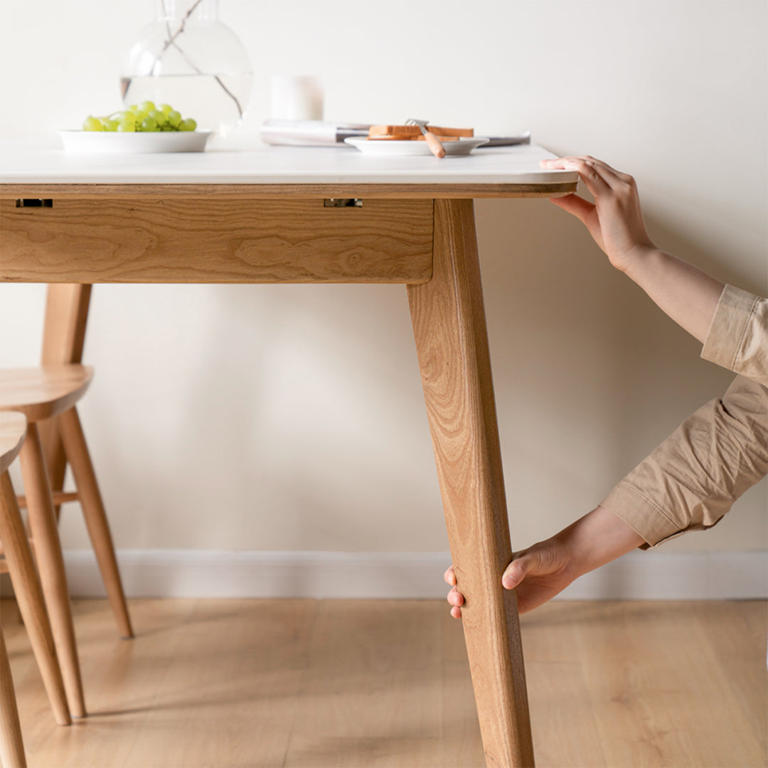Scandinavian oak wood sintered stone extendable dining table shift in close up details.