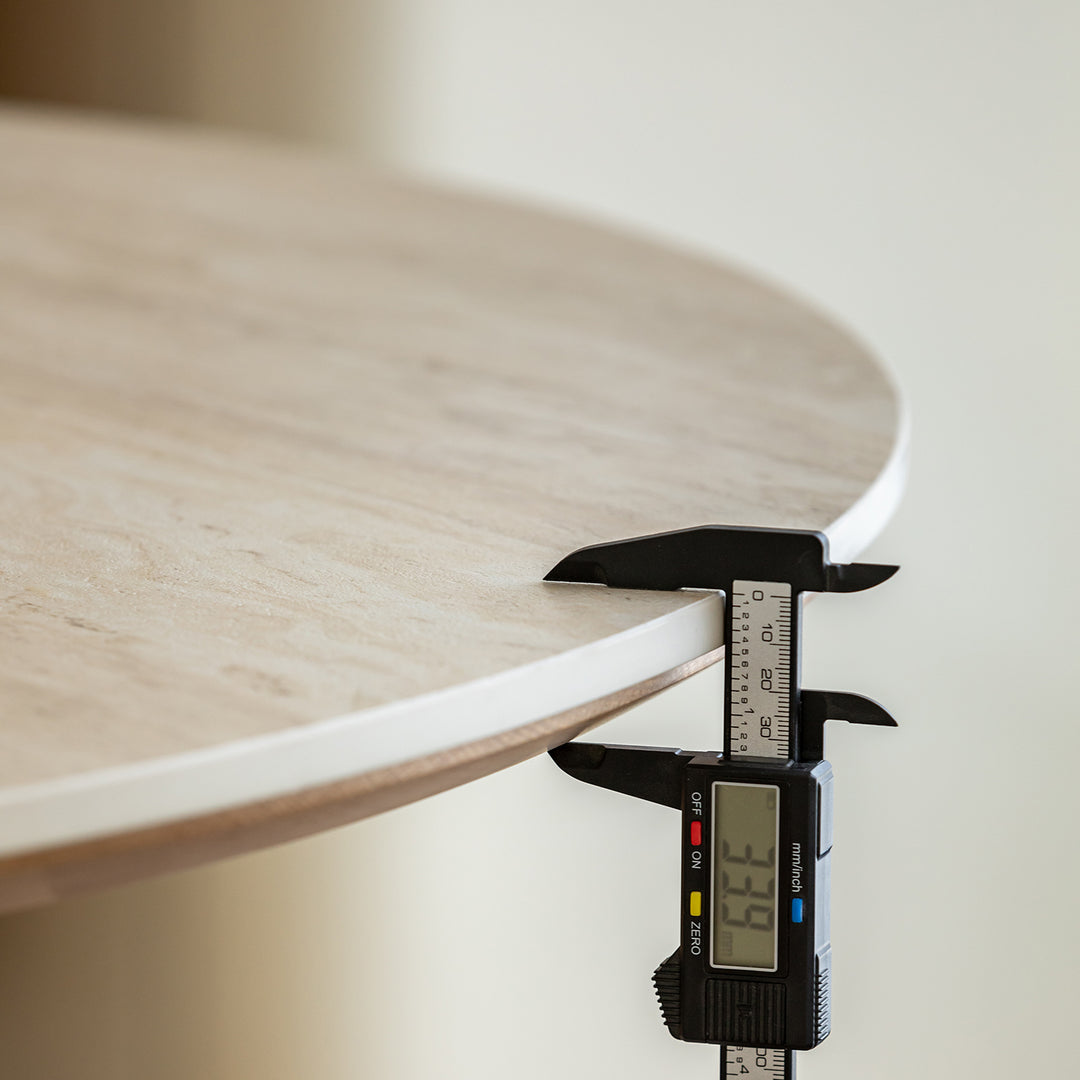 Scandinavian oak wood sintered stone round dining table timeless in panoramic view.
