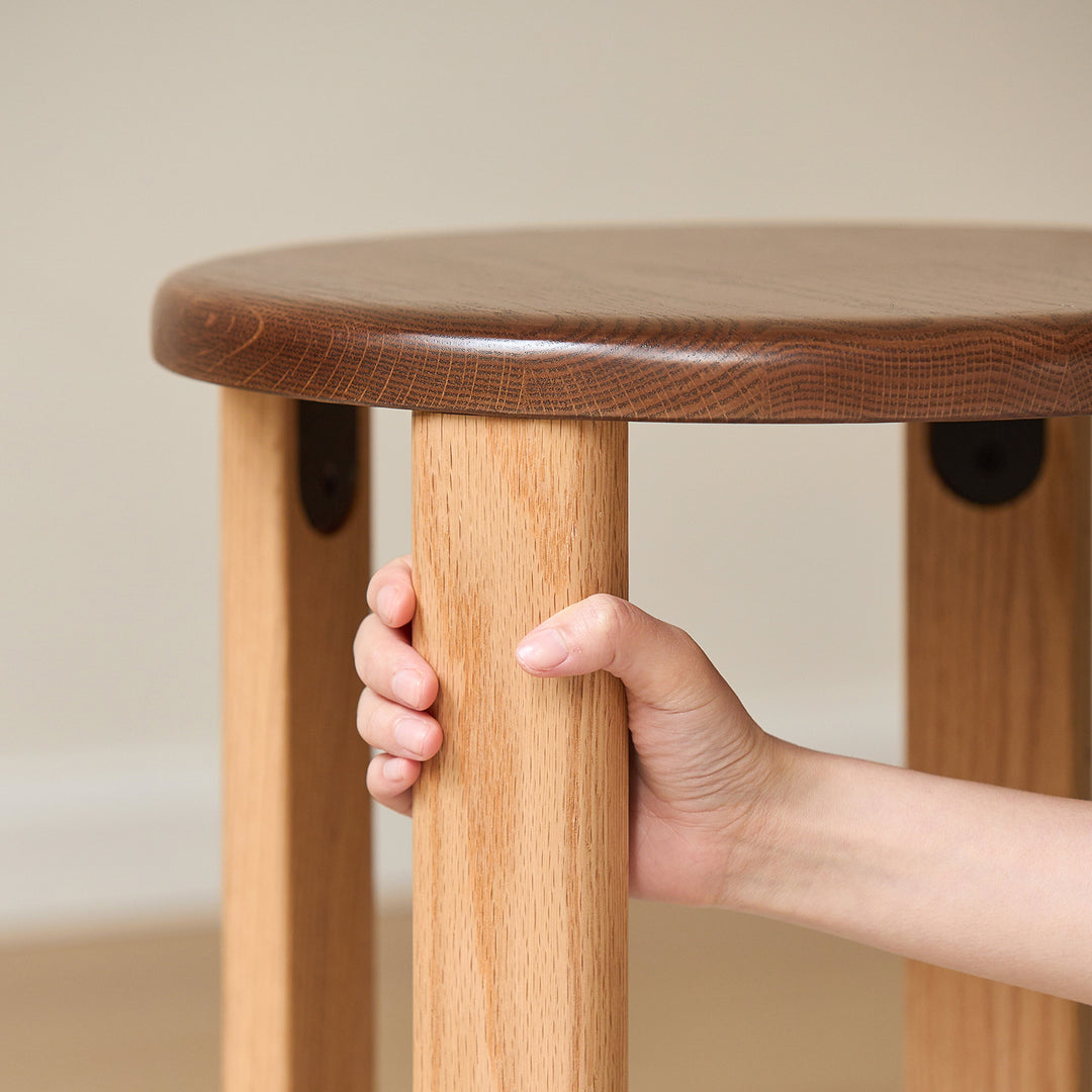 Scandinavian oak wood stackable stool with wheels friday in still life.
