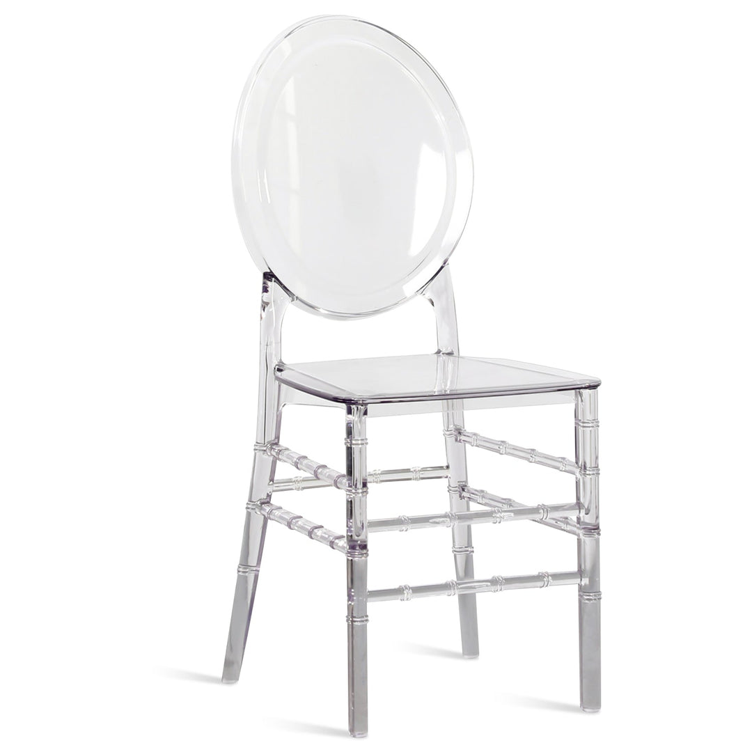 Scandinavian plastic ghost dining chair lia in white background.