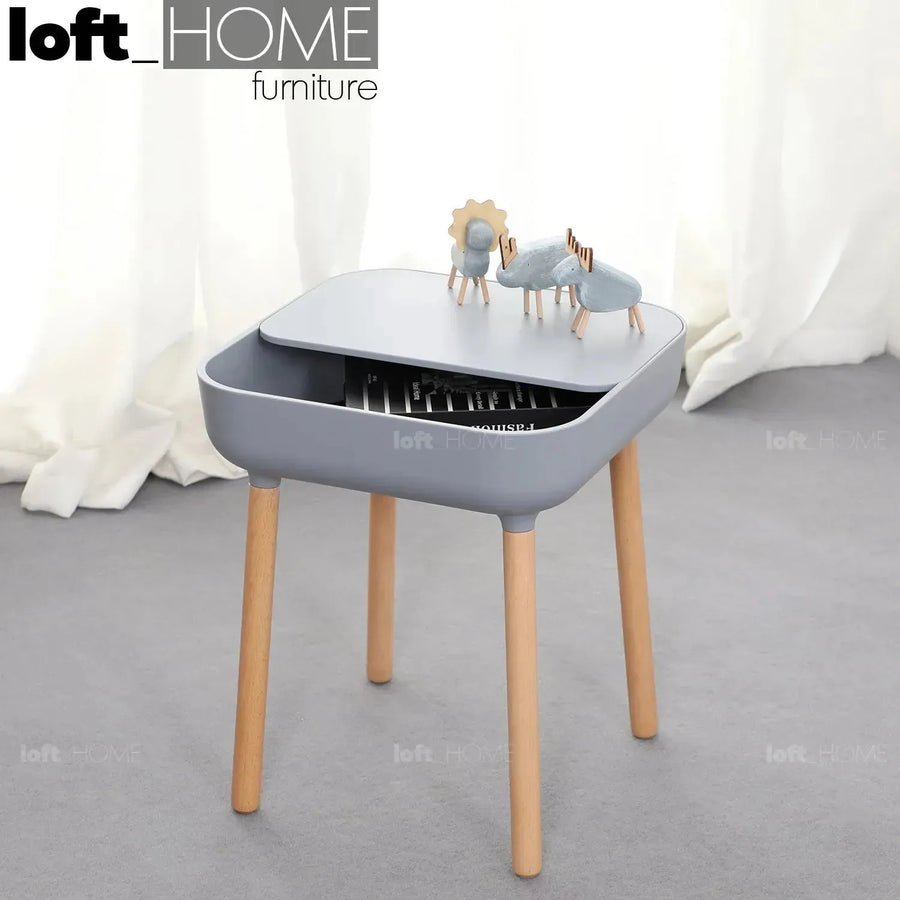 Contemporary plastic side table una with context.