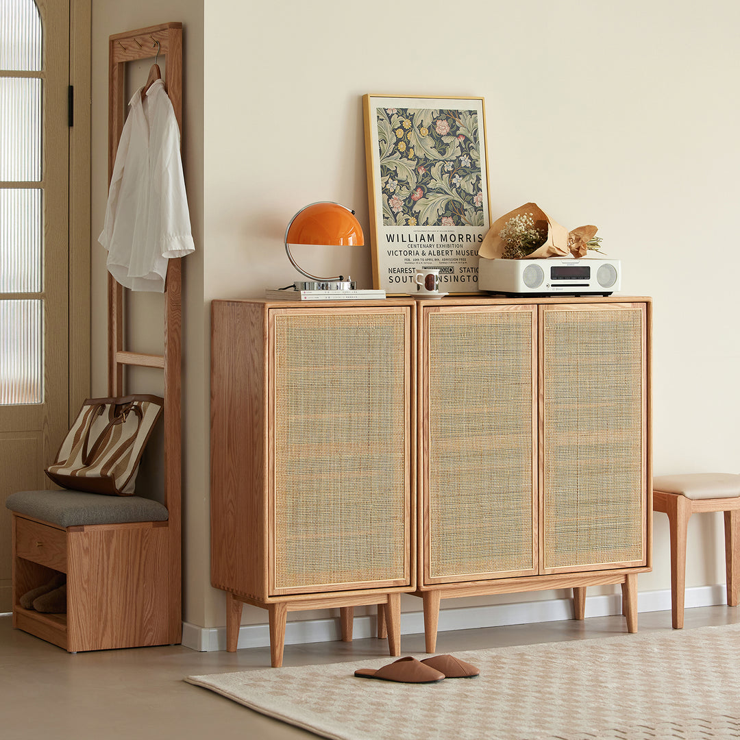 Scandinavian rattan oak wood shoe cabinet beri in still life.