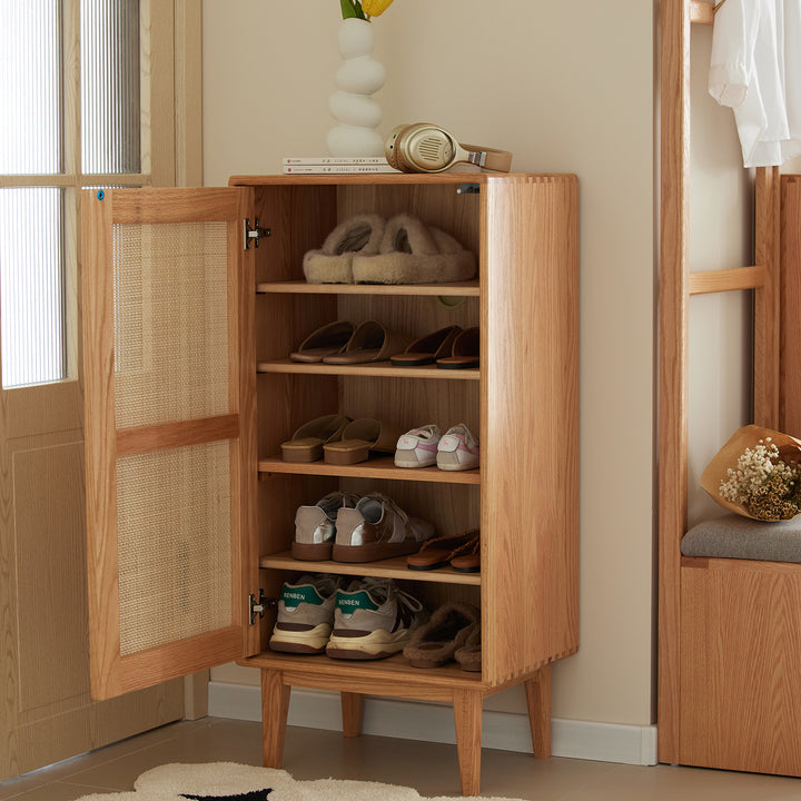 Scandinavian rattan oak wood shoe cabinet beri in close up details.