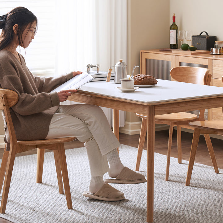 Scandinavian sintered stone oak wood dining table jaden with context.