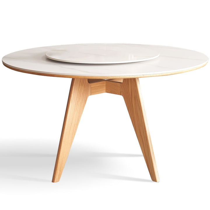 Scandinavian sintered stone round dining table belly in white background.