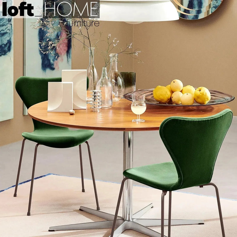 Modern velvet dining chair ant in close up details.
