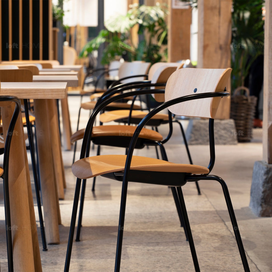Scandinavian wood armrest dining chair pavilion av2 in real life style.