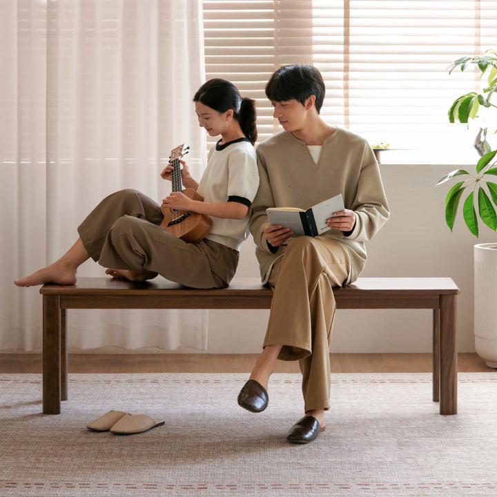 Scandinavian wood dining bench axel in panoramic view.