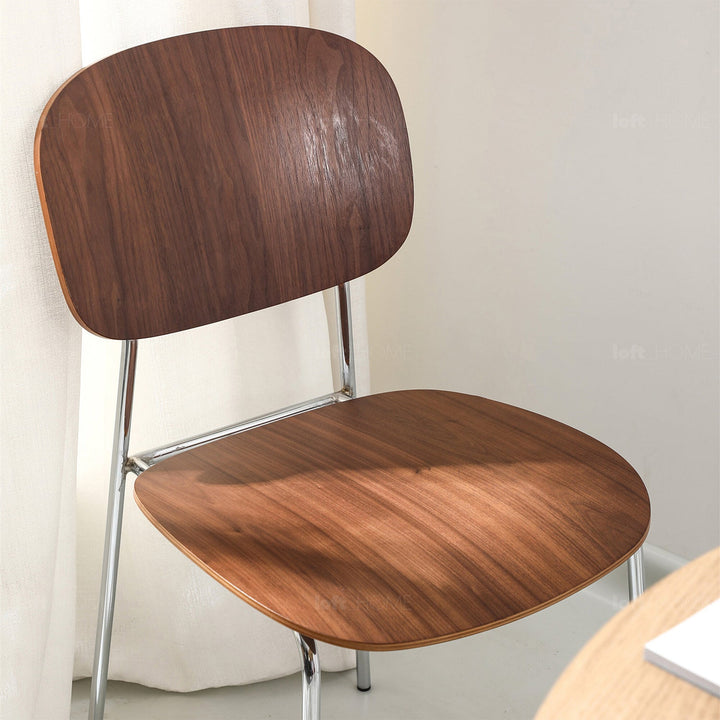 Scandinavian wood dining chair co in panoramic view.