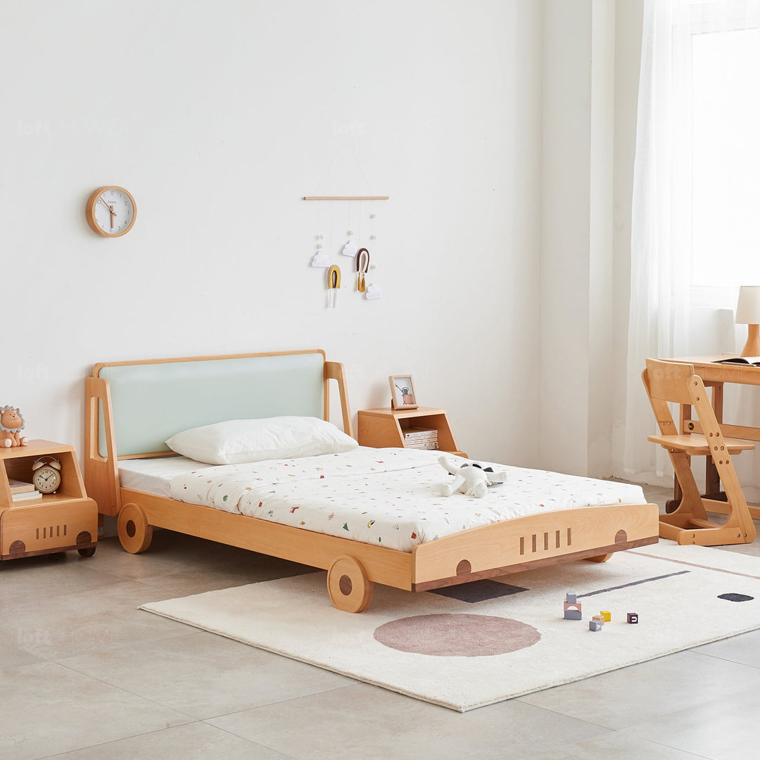 Scandinavian wood kids bed car in close up details.